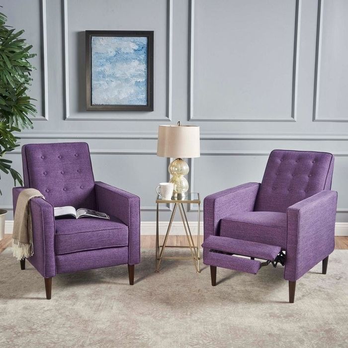 A pair of purple recliner chairs in a stylish living room