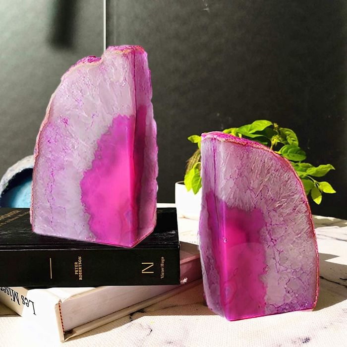 The bookends in a vibrant pink shade