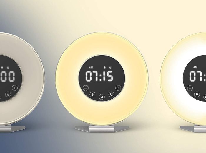 The round digital clock adjusting its brightness in three settings as the time progresses