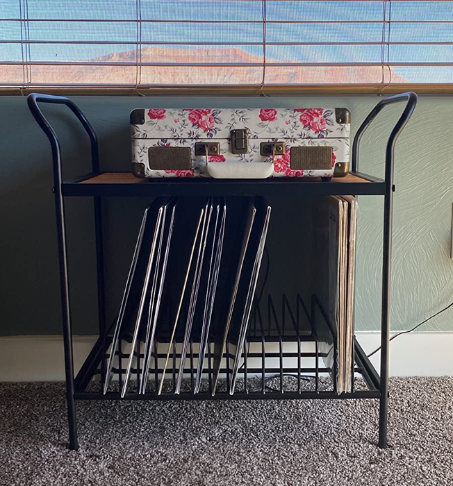 Image of a metal and wooden record player stand with vinyl storage slots at the bottom