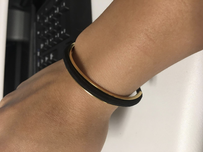 Reviewer showing a different perspective of the cuff worn on their wrist