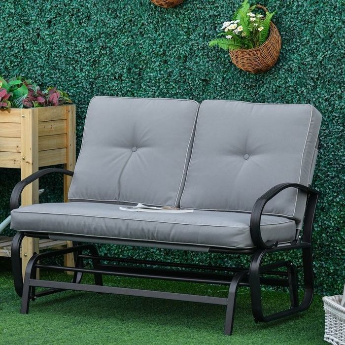 The bench with gray cushions