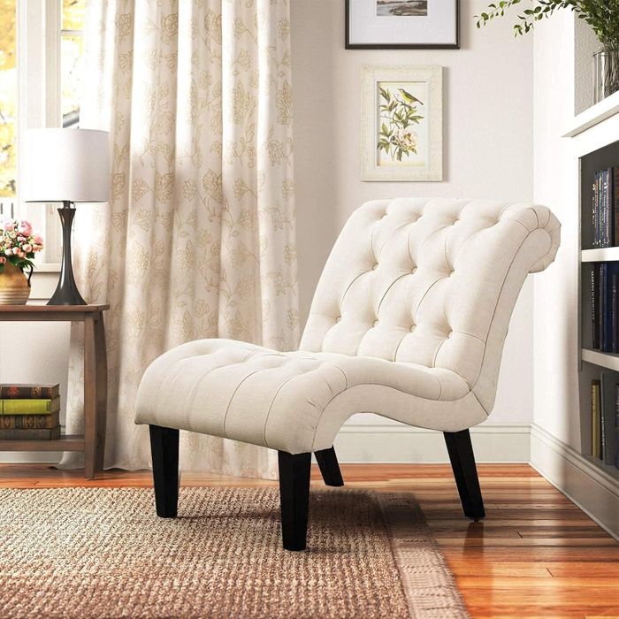 The ivory-colored chair.