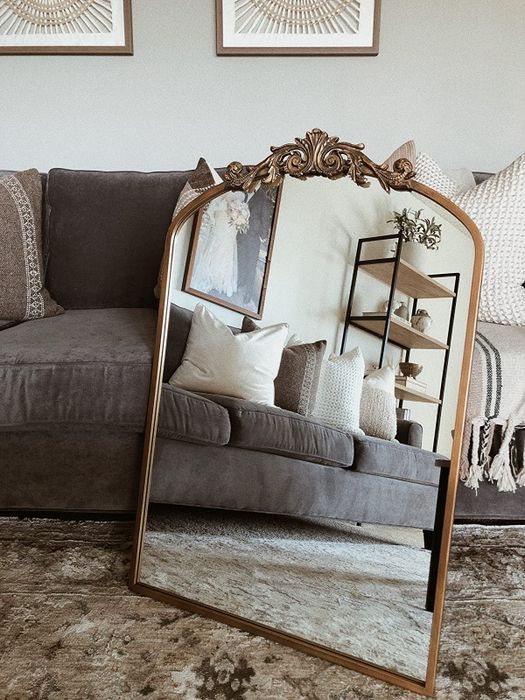 A reviewer’s mirror leaned against a couch.