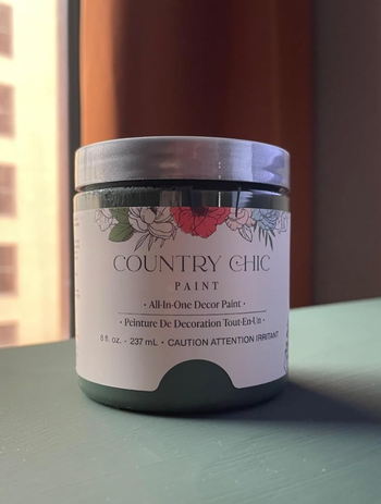 A jar of Country Chic Paint with the label visible.