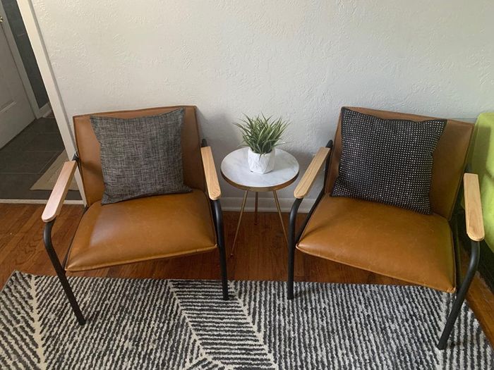 A reviewer photo featuring two of the chairs.