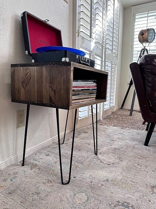 The wooden record stand featuring hairpin legs