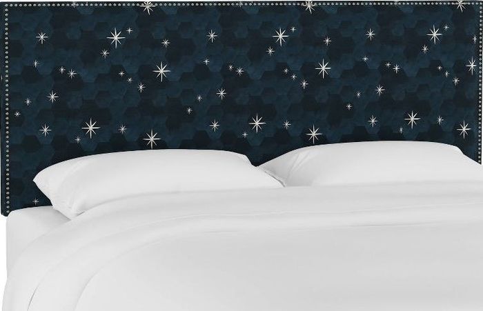 A headboard adorned with star motifs