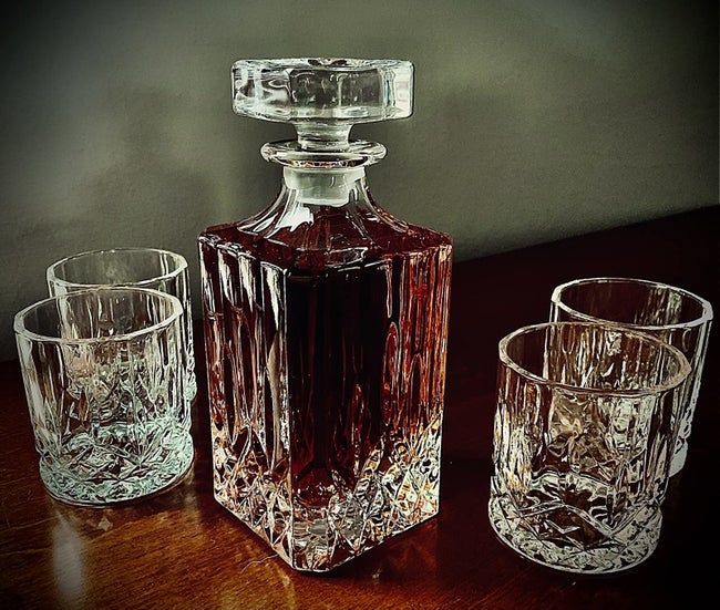 A reviewer’s table adorned with a chic decanter and matching glass set.