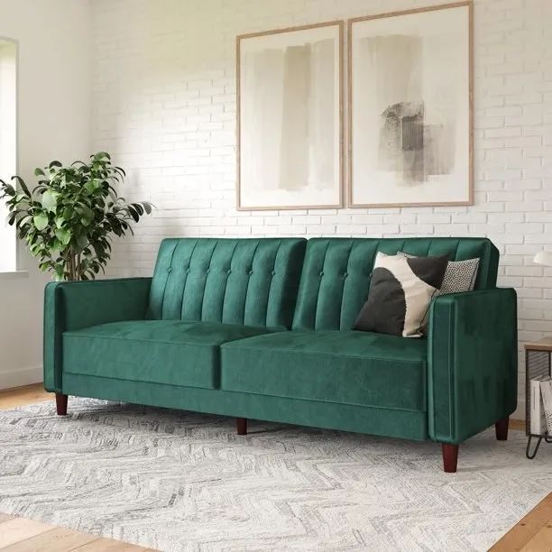 Emerald green velvet sofa.