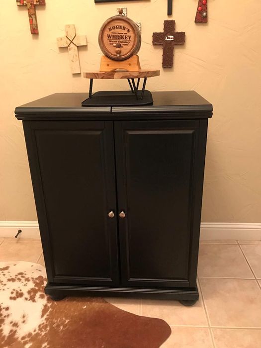 Reviewer image of a black bar cart with doors closed, showcasing a sleek and compact design
