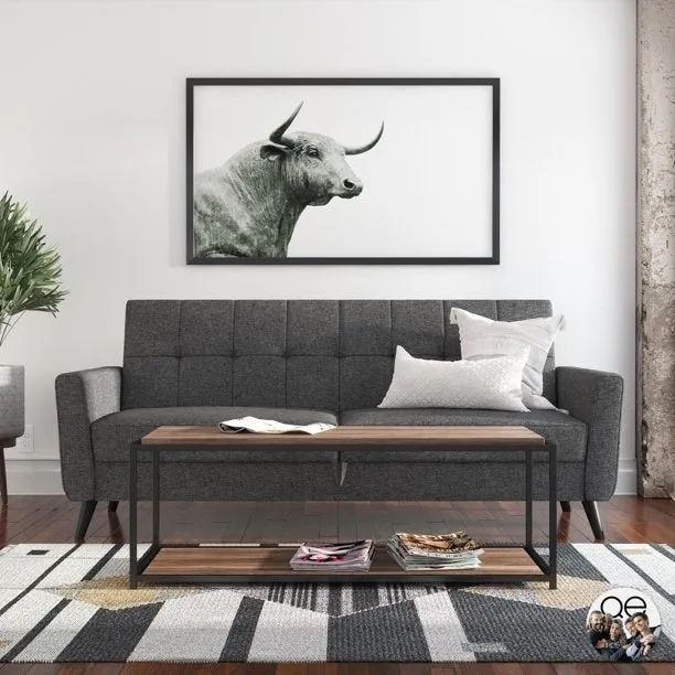 A grey couch in a living room setting.