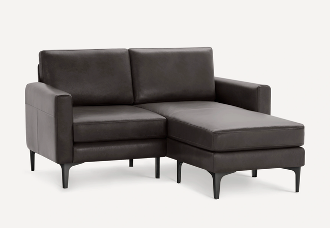 the black leather loveseat with a chaise lounge