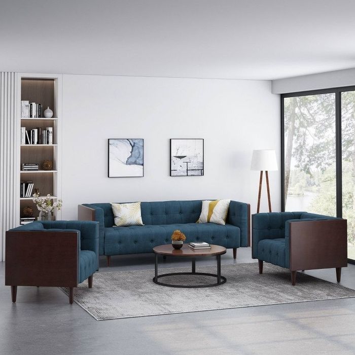 A navy and brown living room set thoughtfully arranged in a living room space.
