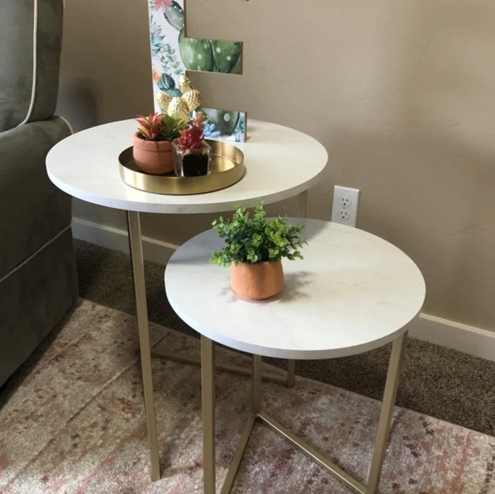 the nesting tables with gold legs and marble tops