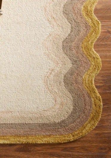 A close-up showing the wave-shaped edges of the rug