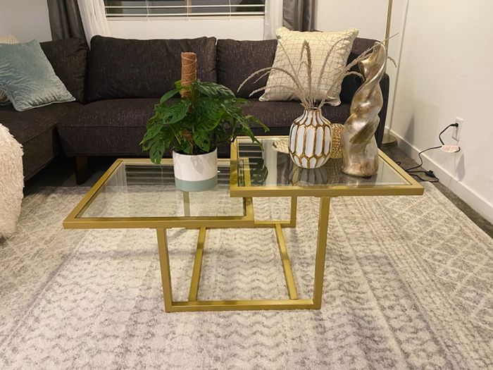Reviewer photo of the gold-toned 2-tier coffee table