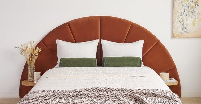 the deep red channeled velvet headboard