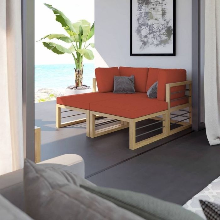 A beige day bed resting peacefully in a living room, the perfect blend of relaxation and style.