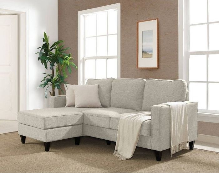 the beige sofa nestled in a beautifully designed living space