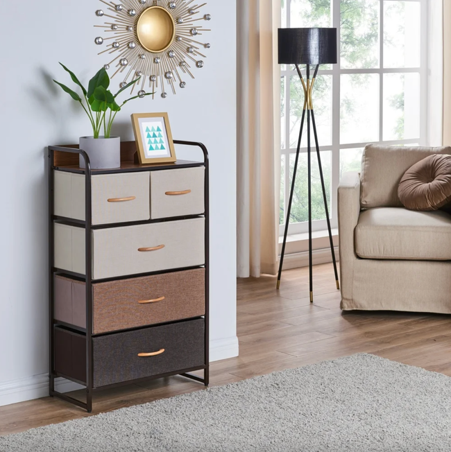Multicolor brown fabric dresser positioned in a living room