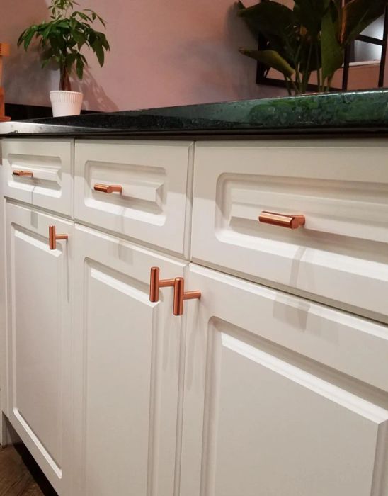 the copper T-shaped knobs