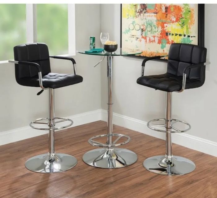 A three-piece pub dining set, complete with two chairs and a table.