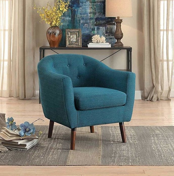 Plush blue armchair with wooden legs