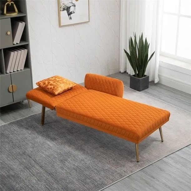 The orange chaise with gold legs, fully extended into a cozy twin bed