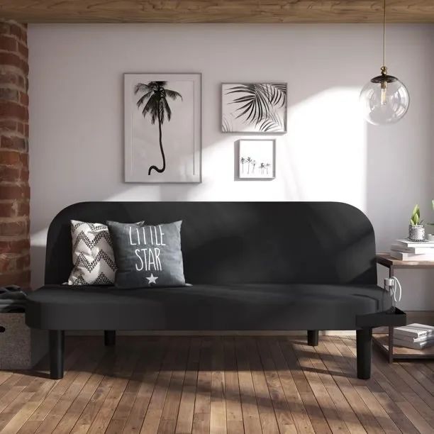 Black sofa with cozy throw pillows