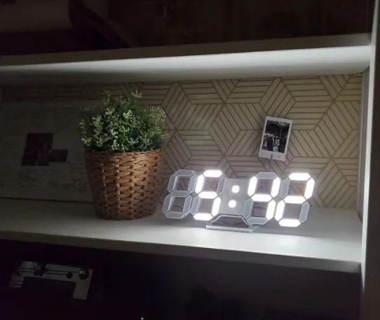 A reviewer’s image showing the digital clock placed on a shelf