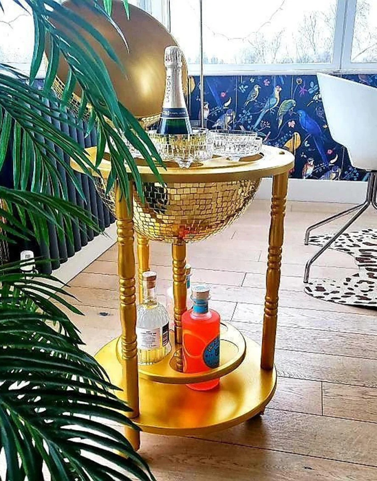 A close-up shot of the gold bar cart when it's opened up
