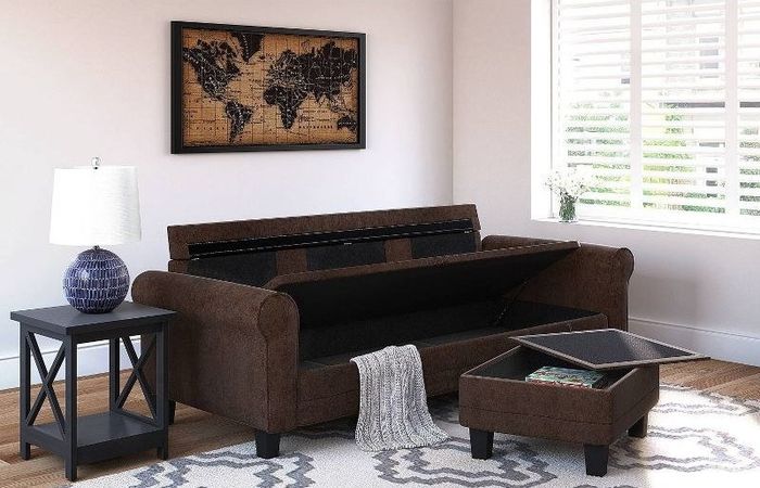 the brown sofa and ottoman both reveal storage compartments when opened