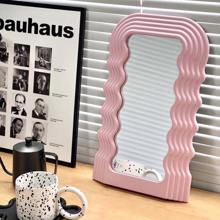 The pink wavy mirror captured in a customer’s photo