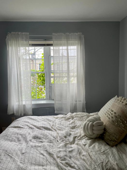 a Mytour editor's bedroom featuring the white curtains