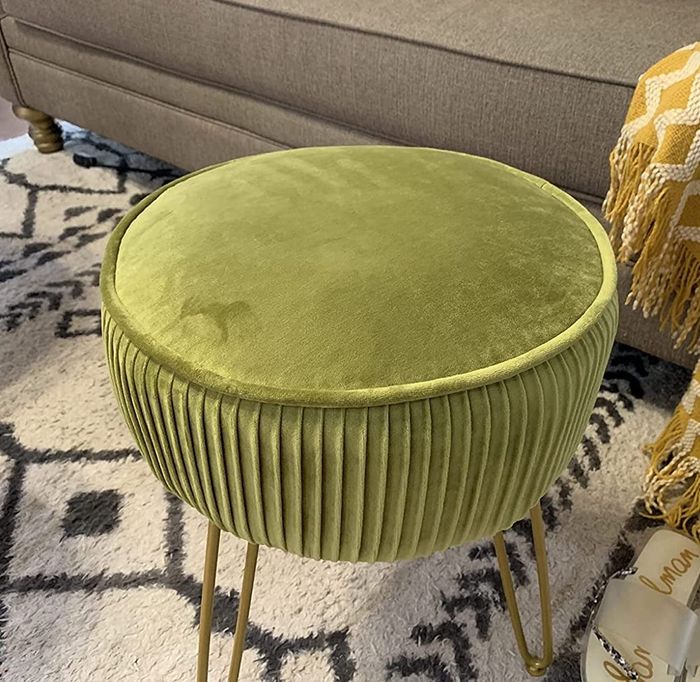 Reviewer close-up of the green pleated footstool