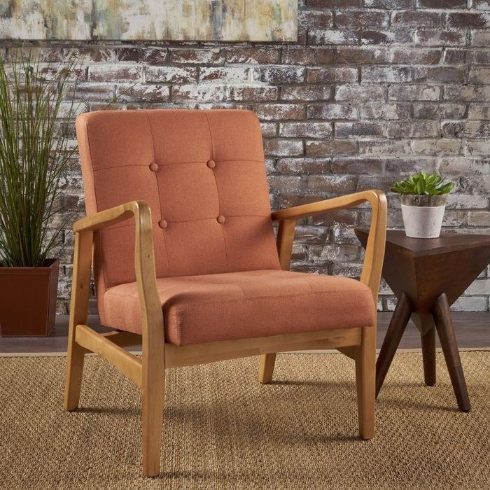 An image of a tufted club chair.
