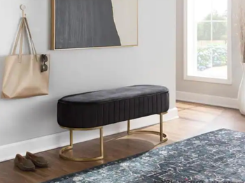 black bench placed in an entryway