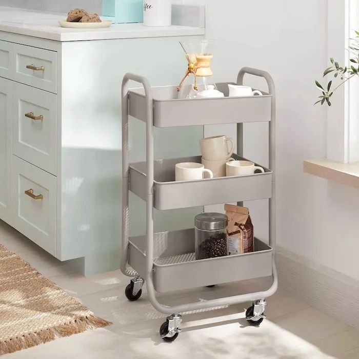 Gray rolling cart filled with various kitchen essentials