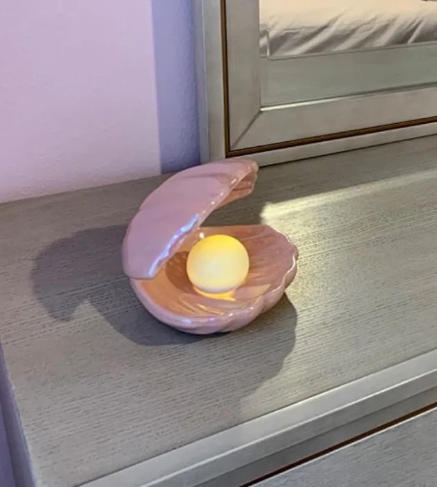 The same shell in a pink color with a glowing LED light