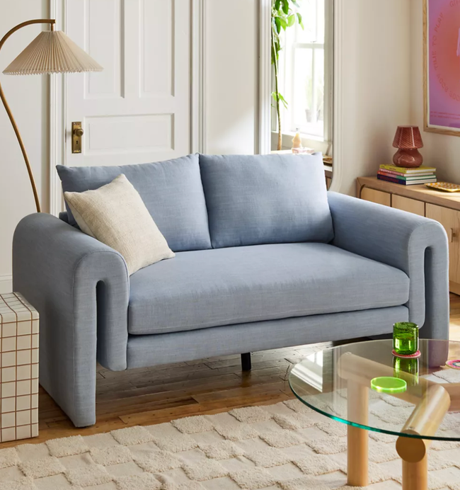 The sky blue Mabelle sofa in a cozy living room setting