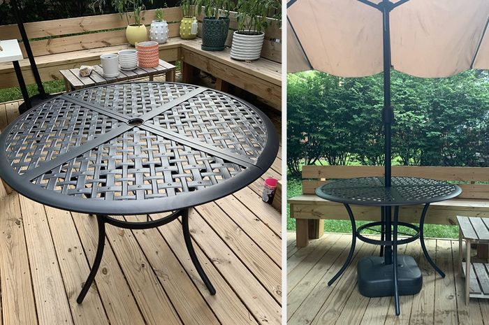 A review image showcasing a round black wrought iron table on a wooden porch