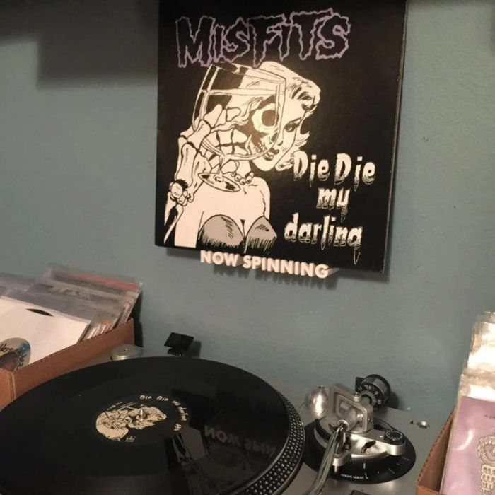 a white, 3D-printed shelf with a unique design that reads,