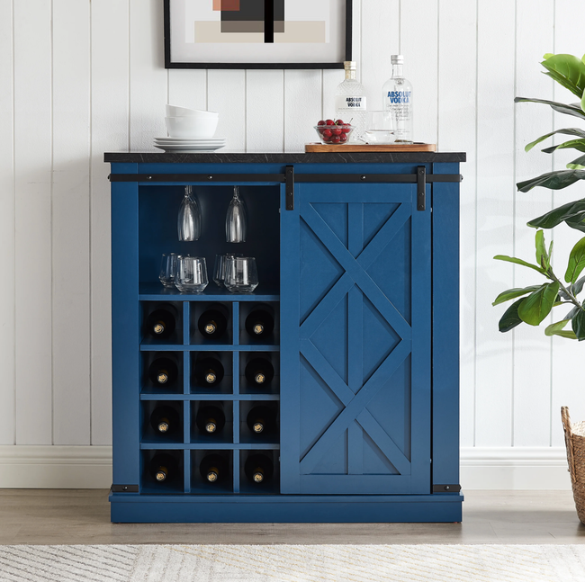 Bar cabinet in blue with a farmhouse door and cubby shelves