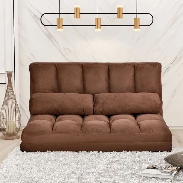 A brown sofa resting on the floor
