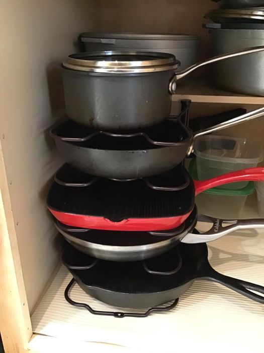 Another reviewer shares how they use the organizer to keep their pans in order.