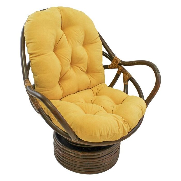 A round, cushioned chair with a tufted, plush seat and curved wooden frame, perfect for adding a cozy and stylish touch to any home decor