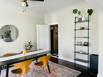 A shelf positioned in the dining room