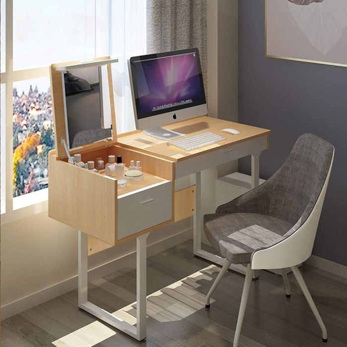 The product featuring makeup, a mirror, and a desktop space neatly organized on top