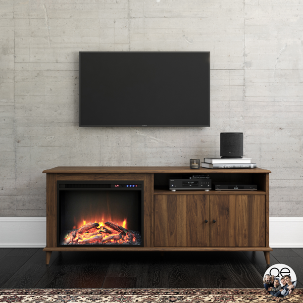 a brown faux wood TV stand with a cabinet and an integrated electric fireplace